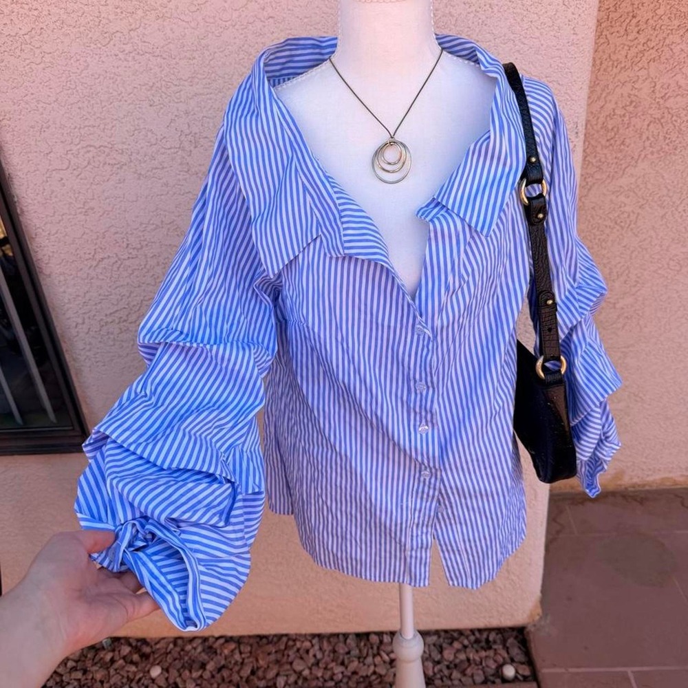 Blue and white striped blouse with ruffle sleeves
